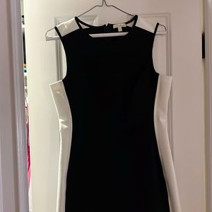 Black Shoshanna dress with white down the sides. Form fitting. Never worn.